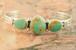 3 Beautiful Genuine Manassa Turquoise Stones set in Sterling Silver Bracelet. This Turquoise is also referred to as King�s Manassa Turquoise. The Manassa Turquoise mine is located in Manassa, Conejos County, Colorado. Created by Navajo Artist Larson Lee. Signed by the artist.
